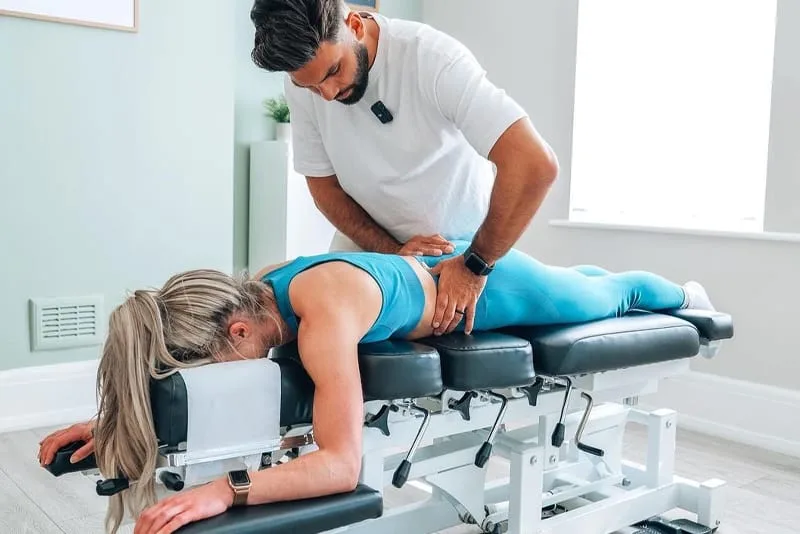 Chiropractor treating a patient’s low back