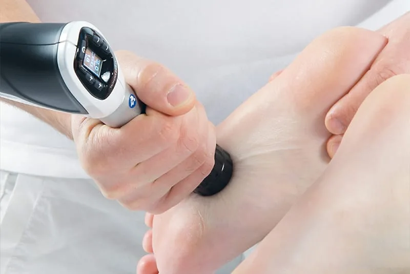 Shockwave handpiece applied to a heel